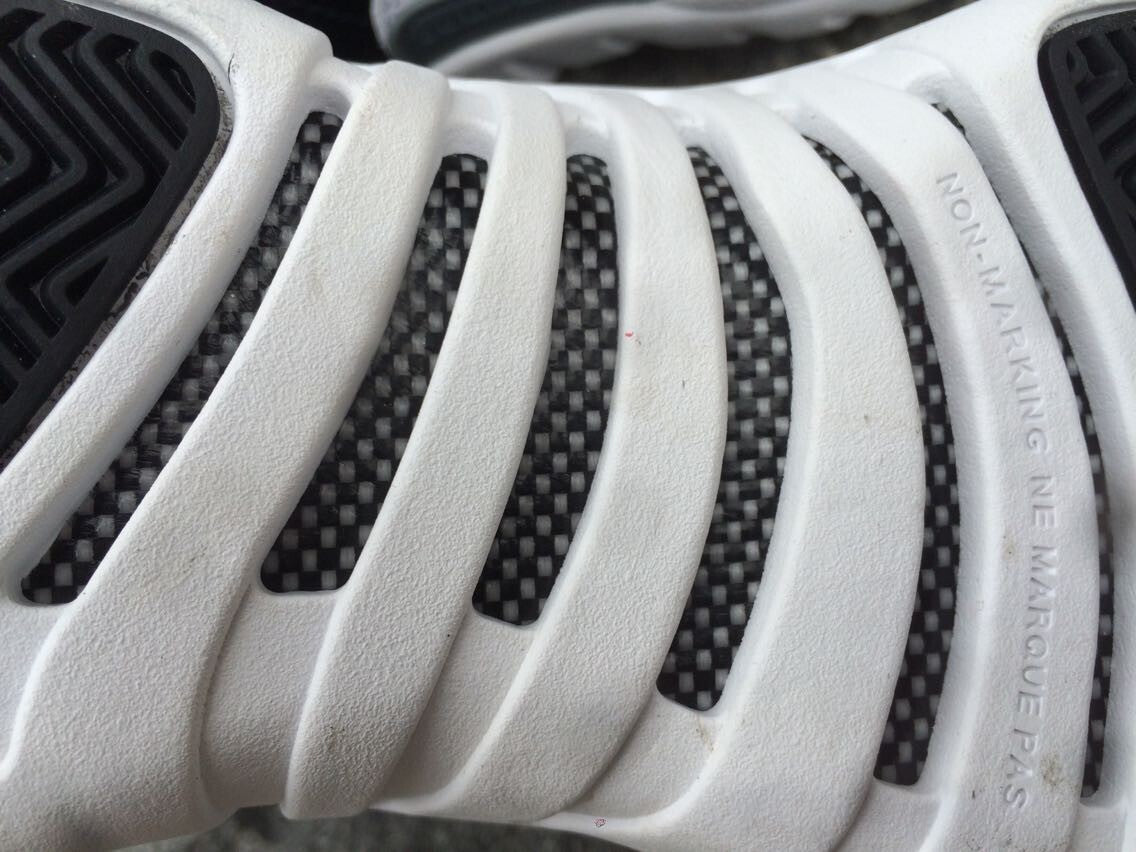 Women's Air Jordan 12 High-Top Sneakers, Black and White - product image from the listing.