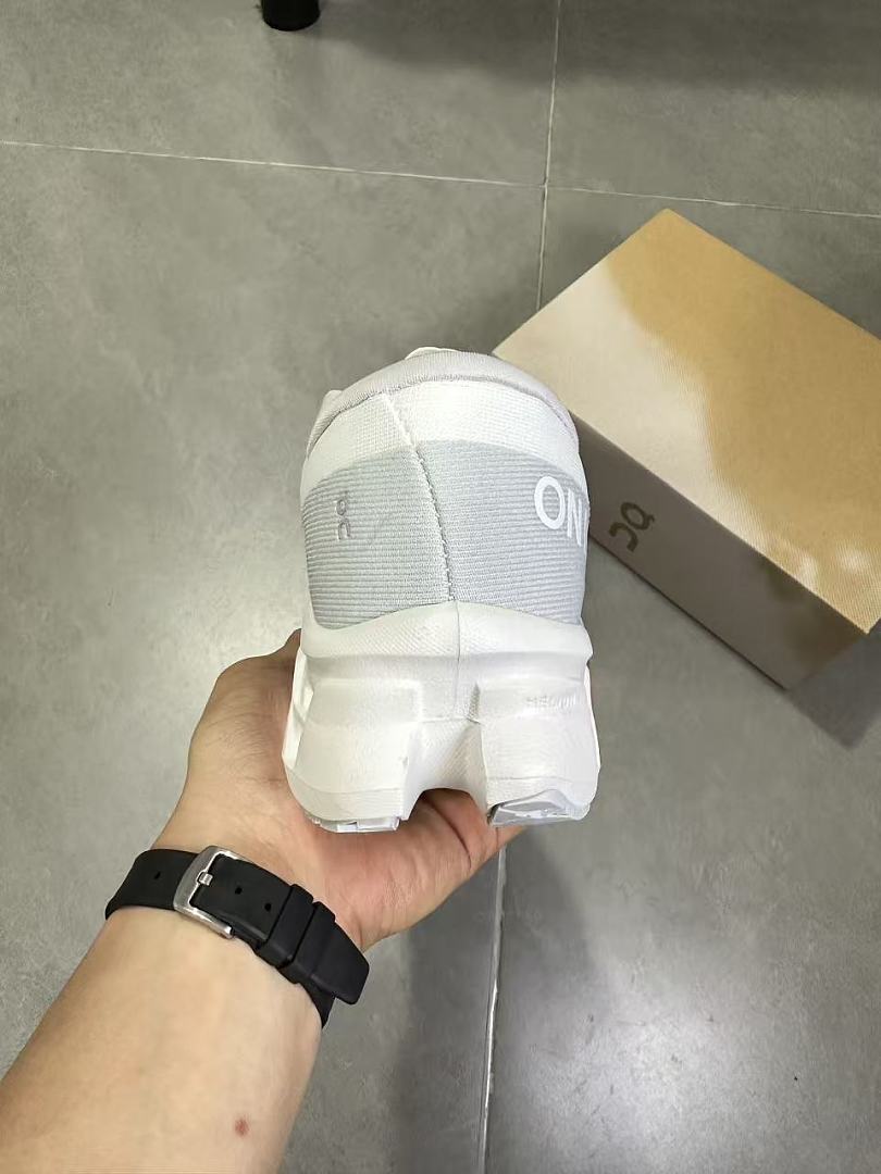 On Running Running Sneakers in White and Gray - product image from the listing.