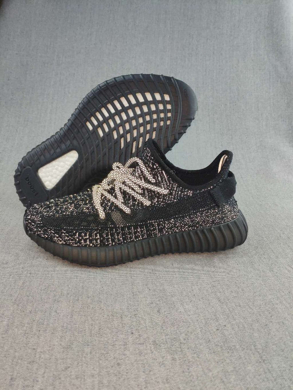 Black and Cream Yeezy 350 V2 Knit Sneakers - product image from the listing.