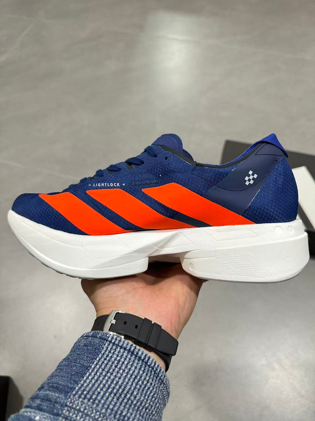 Nike Adizero Lightstrike Pro Running Shoes, in Navy and Orange - product image from the listing.