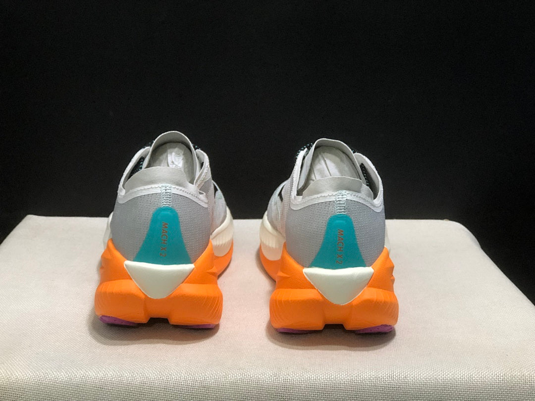 Gray and Orange HOKA Mach X 2 Running Shoes - product image from the listing.