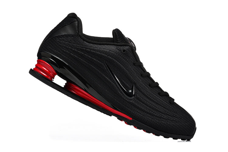Nike Low-Top Sneakers in Black and Red - product image from the listing.