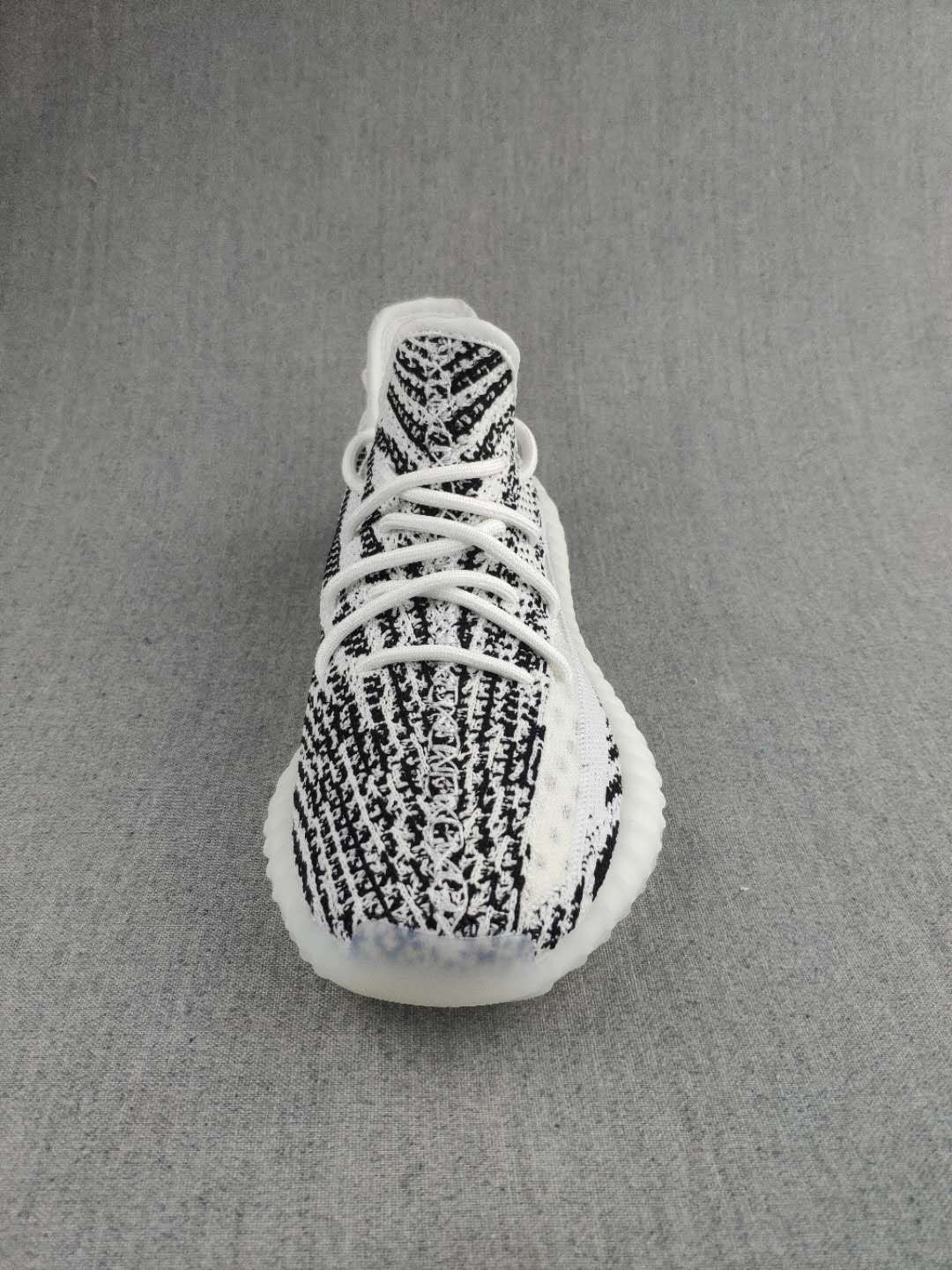 Black and White Yeezy 350 V2 Knit Sneakers - product image from the listing.