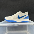 Nike Sneakers in Cream and Blue - product image from the listing.