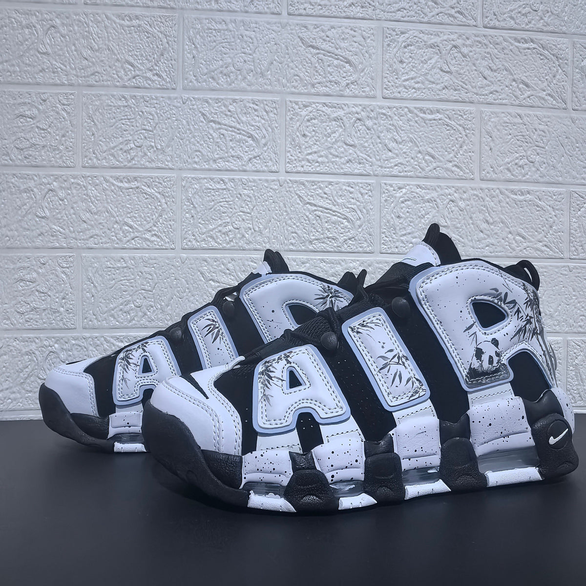Nike Air More Uptempo Panda Sneakers in Black and White - product image from the listing.