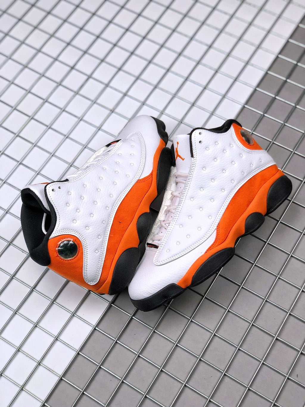 Air Jordan 13 Starfish White Orange Sneakers 414571-108 - product image from the listing.
