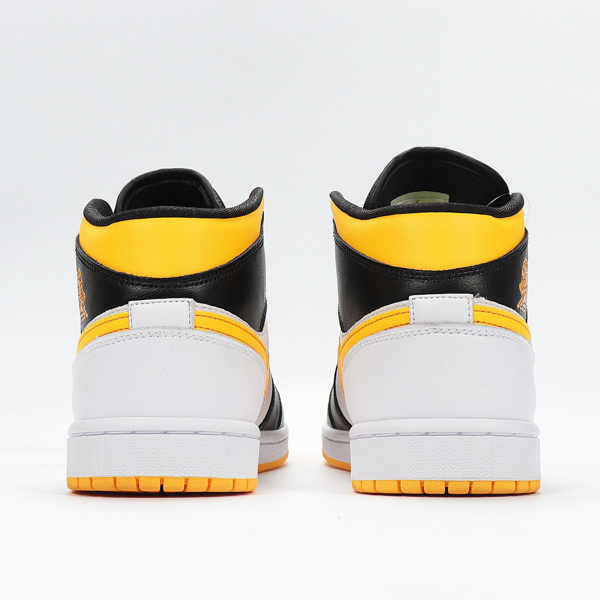 Jordan 1 High Sneakers in Black Yellow White CV5276-107 - product image from the listing.