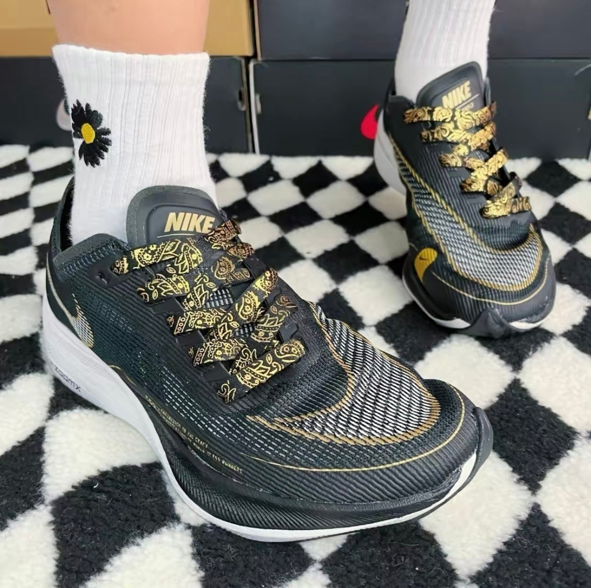 Nike ZoomX Vaporfly NEXT% 2 Running Shoes in Black Gold CU4111-001 - product image from the listing.