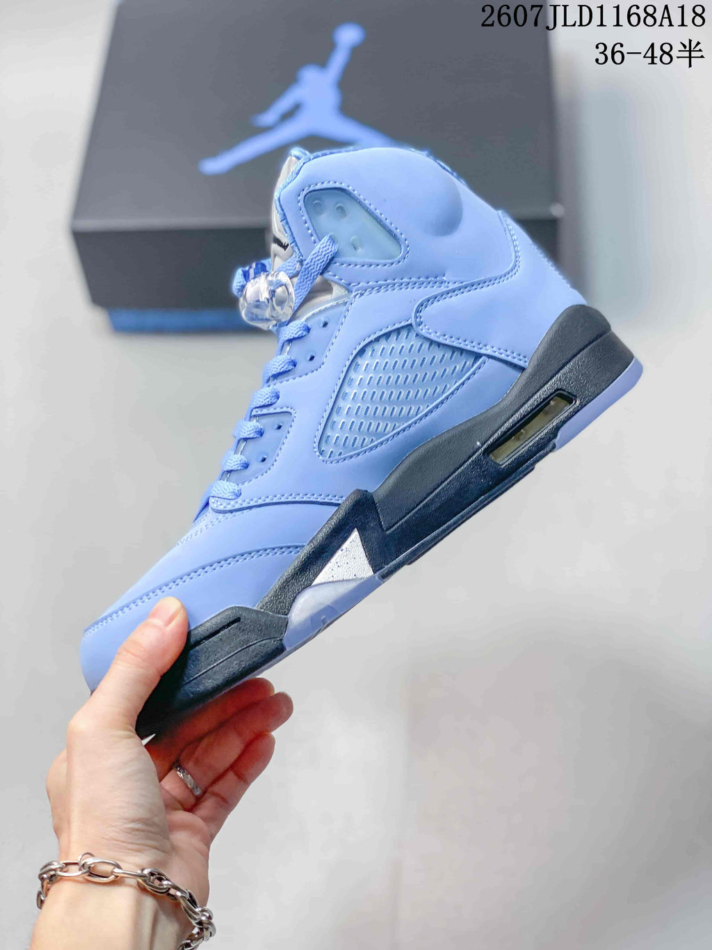 Air Jordan 5 UNC High-Top Sneakers in Blue - product image from the listing.
