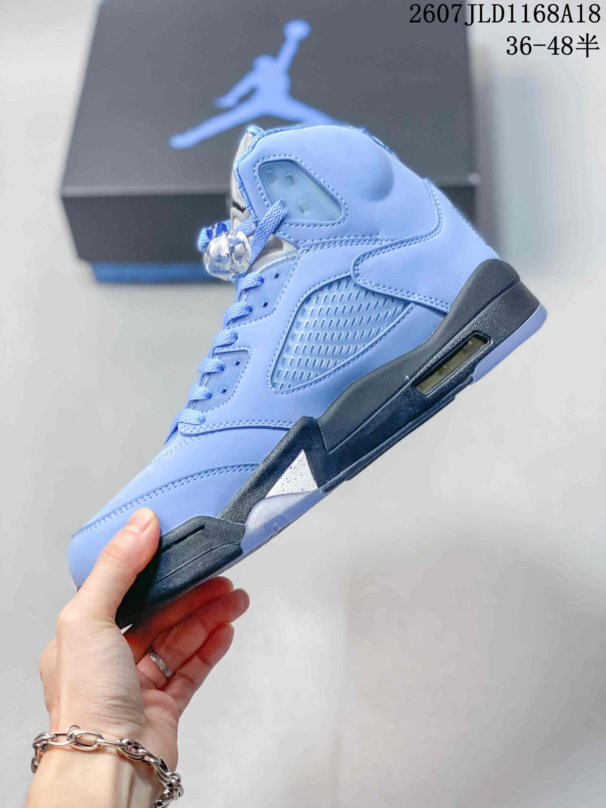 Air Jordan 5 UNC High-Top Sneakers in Blue - product image from the listing.