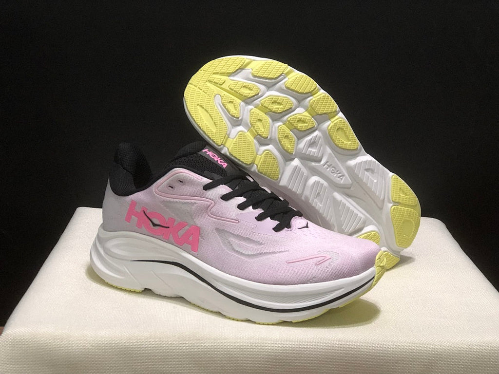 Pink and White HOKA Clifton 10 Running Shoes - product image from the listing.