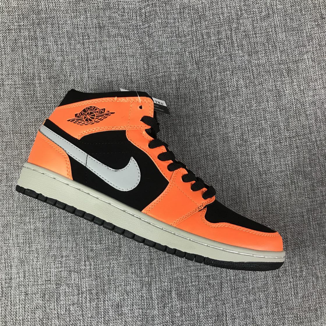 Air Jordan 1 Mid Sneakers in Black Orange 554724-062 - product image from the listing.