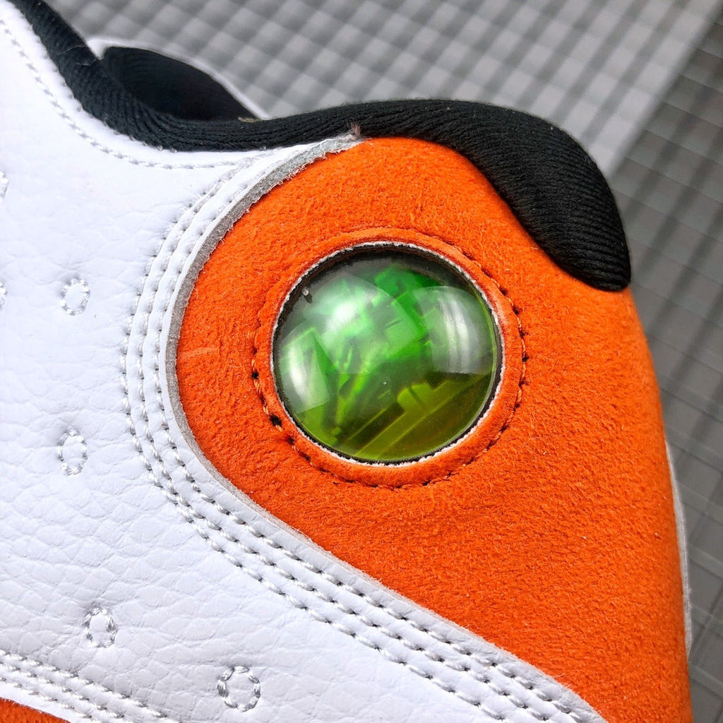 Air Jordan 13 Starfish White Orange Sneakers 414571-108 - product image from the listing.