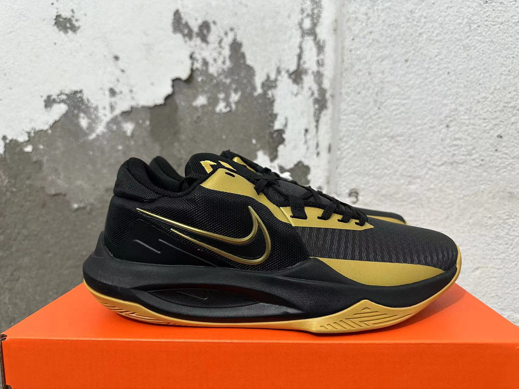 Nike Basketball Sneakers in Black and Gold - product image from the listing.