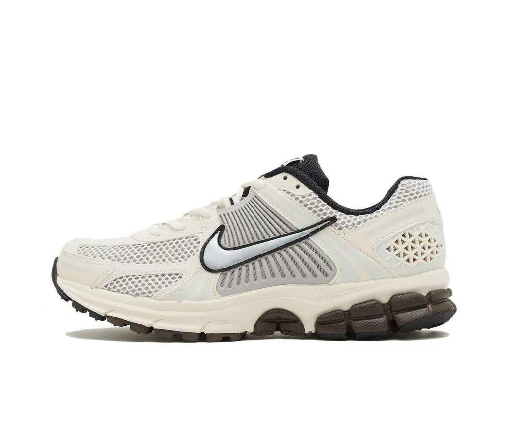 Metallic Silver and White Nike Vomero 5 Sneakers - product image from the listing.