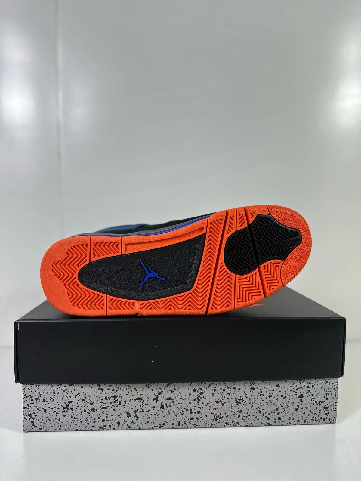 Air Jordan 4 Retro Black Blue Orange Sneakers - product image from the listing.