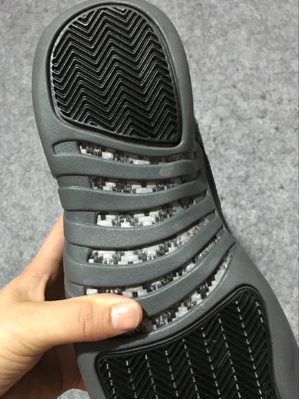Black and Grey Air Jordan 12 High-Top Sneakers - product image from the listing.
