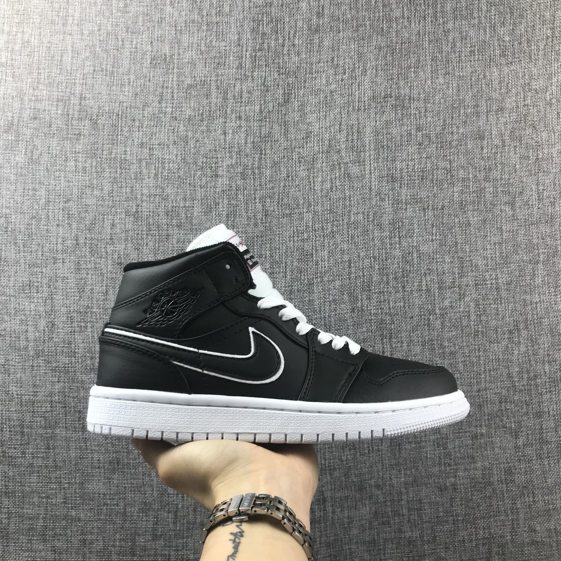 Air Jordan 1 Mid Sneakers in Black and White 852542-016 - product image from the listing.