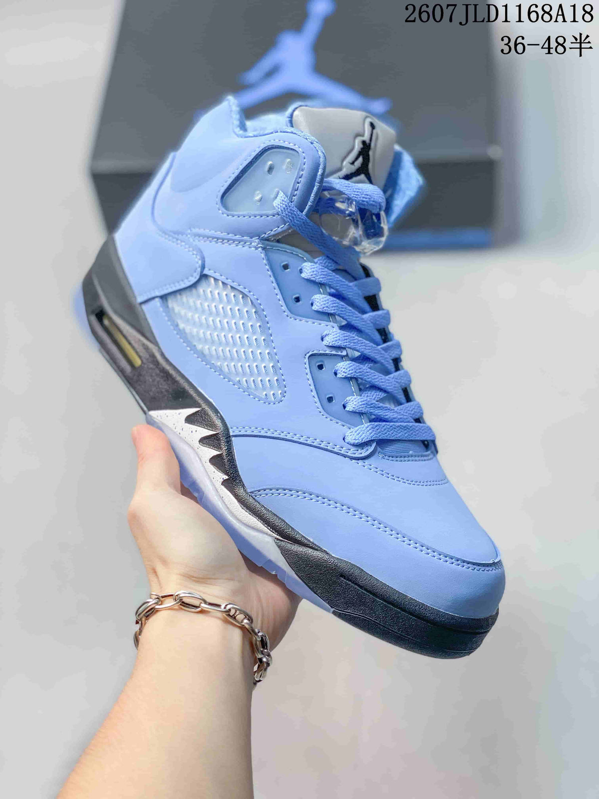 Air Jordan 5 UNC High-Top Sneakers in Blue - product image from the listing.