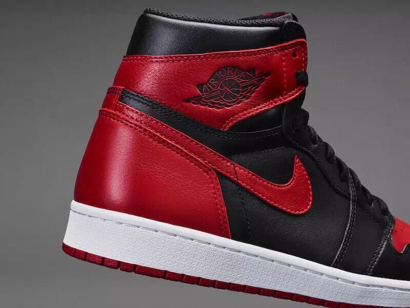 Air Jordan 1 High Sneakers in Black and Red - product image from the listing.