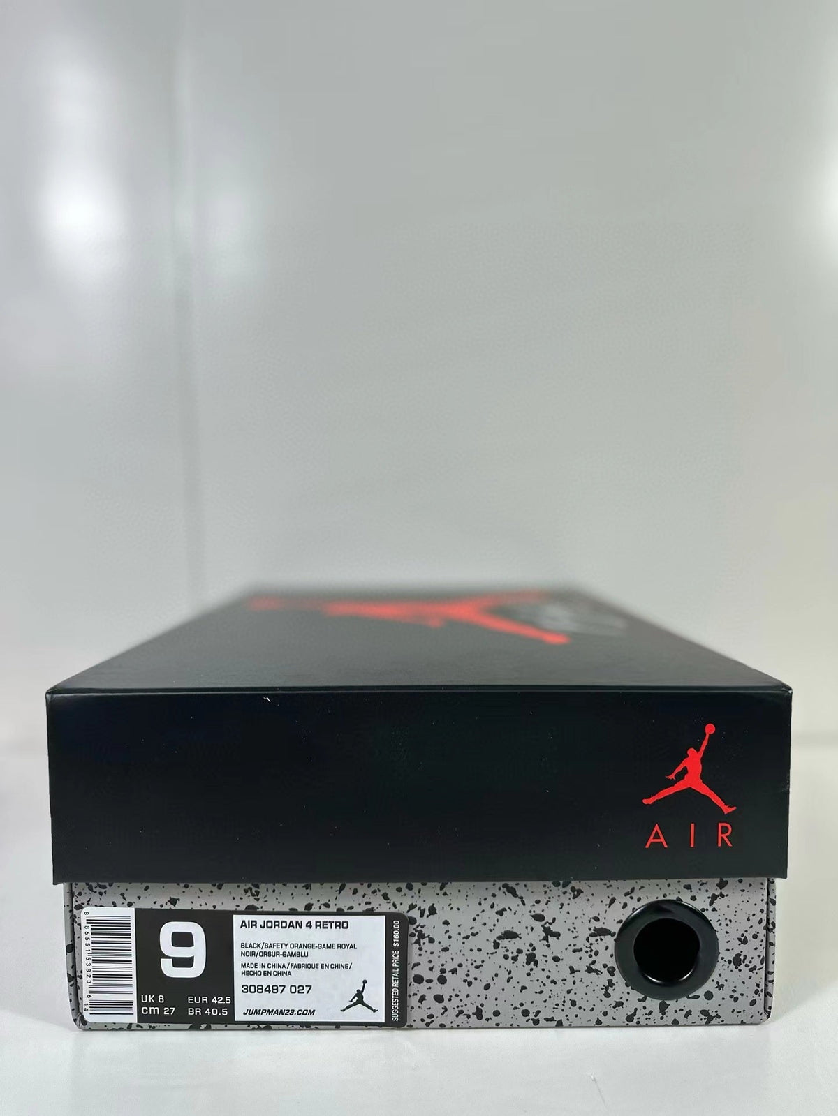 Air Jordan 4 Retro Black Blue Orange Sneakers - product image from the listing.
