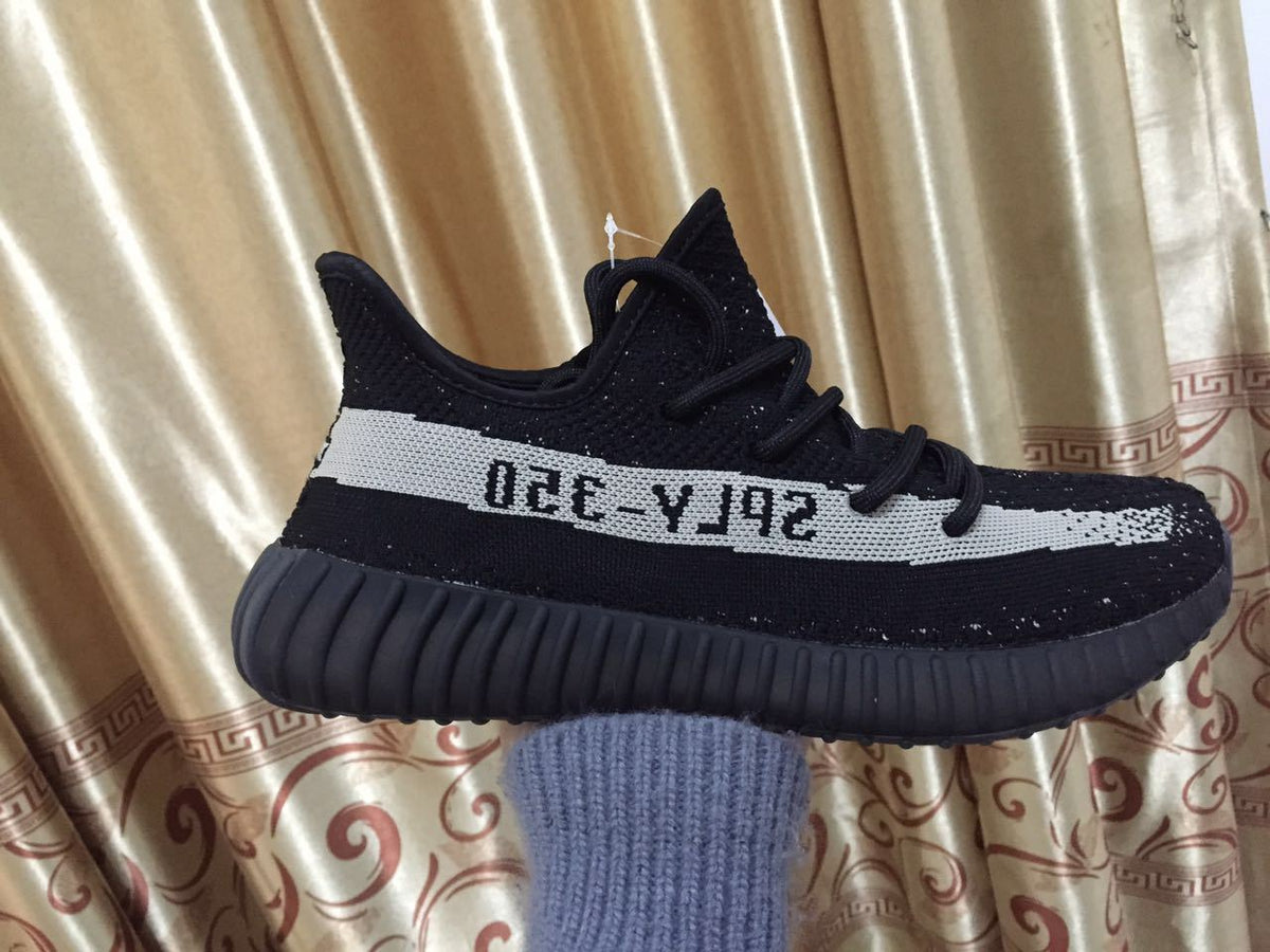 Adidas Yeezy Boost 350 V2 Sneakers in Black White - product image from the listing.