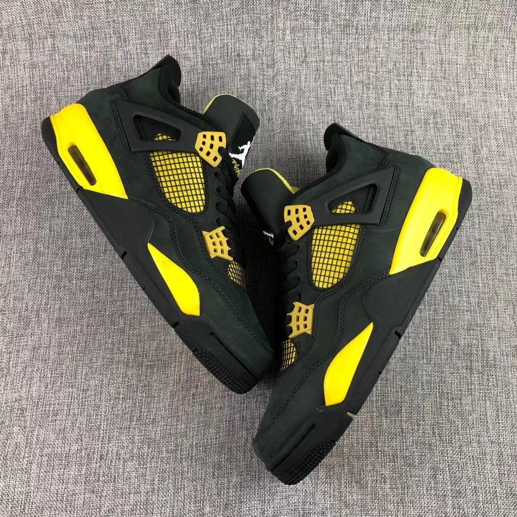 Air Jordan 4 Thunder Black Yellow Sneakers - product image from the listing.