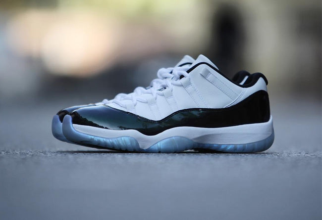 White and Black Air Jordan 11 Iridescent Sneakers - product image from the listing.
