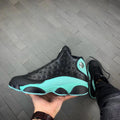 Air Jordan 13 Island Green Sneakers in Black Turquoise - product image from the listing.