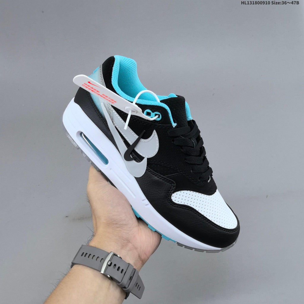 Nike Air Max 1 Sneakers in Black White and Turquoise - product image from the listing.