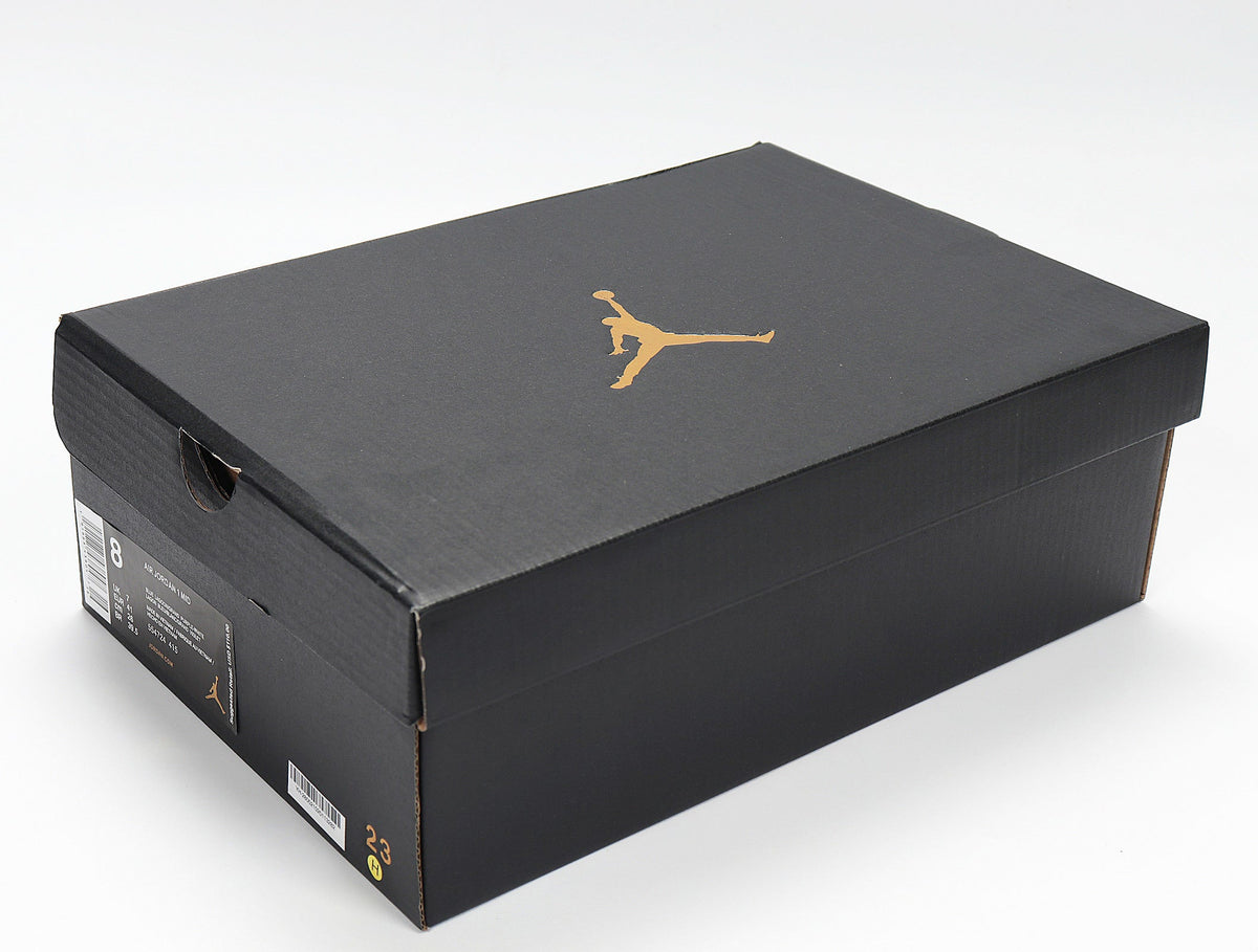 Air Jordan 1 Mid GS White and Blue Sneakers 554724-415 - product image from the listing.