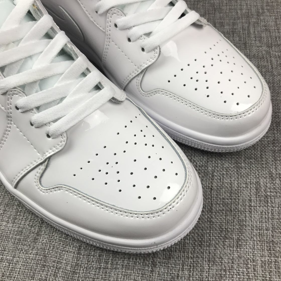 Air Jordan 1 Mid White Patent-Style Sneakers BQ6472-111 - product image from the listing.