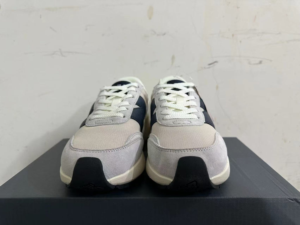 Gray and Navy New Balance U370 Sneakers - product image from the listing.