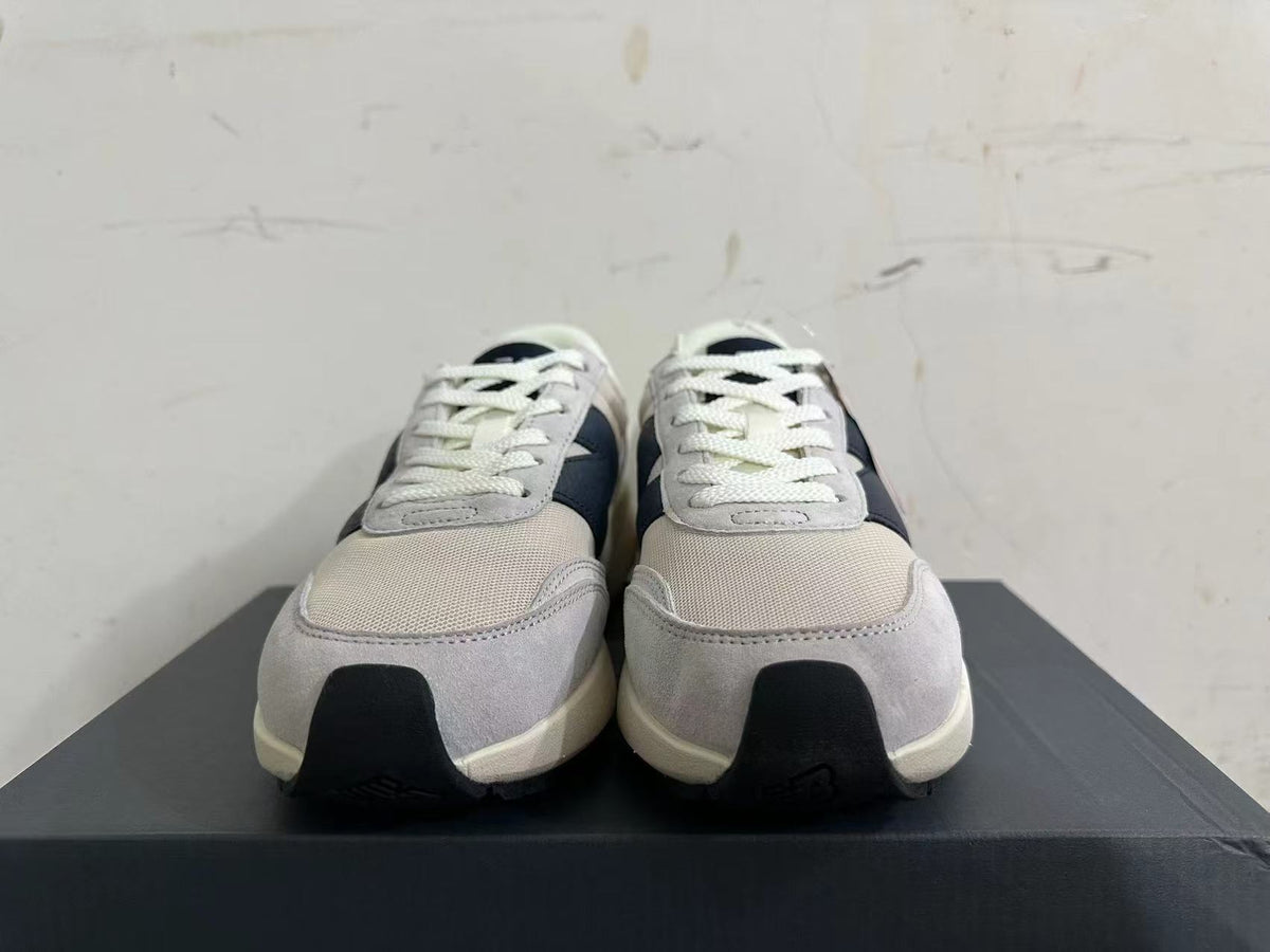 Gray and Navy New Balance U370 Sneakers - product image from the listing.