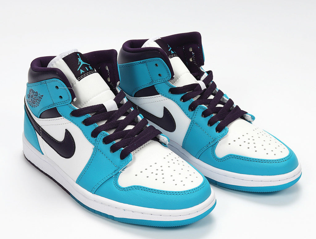 Air Jordan 1 Mid GS White and Blue Sneakers 554724-415 - product image from the listing.