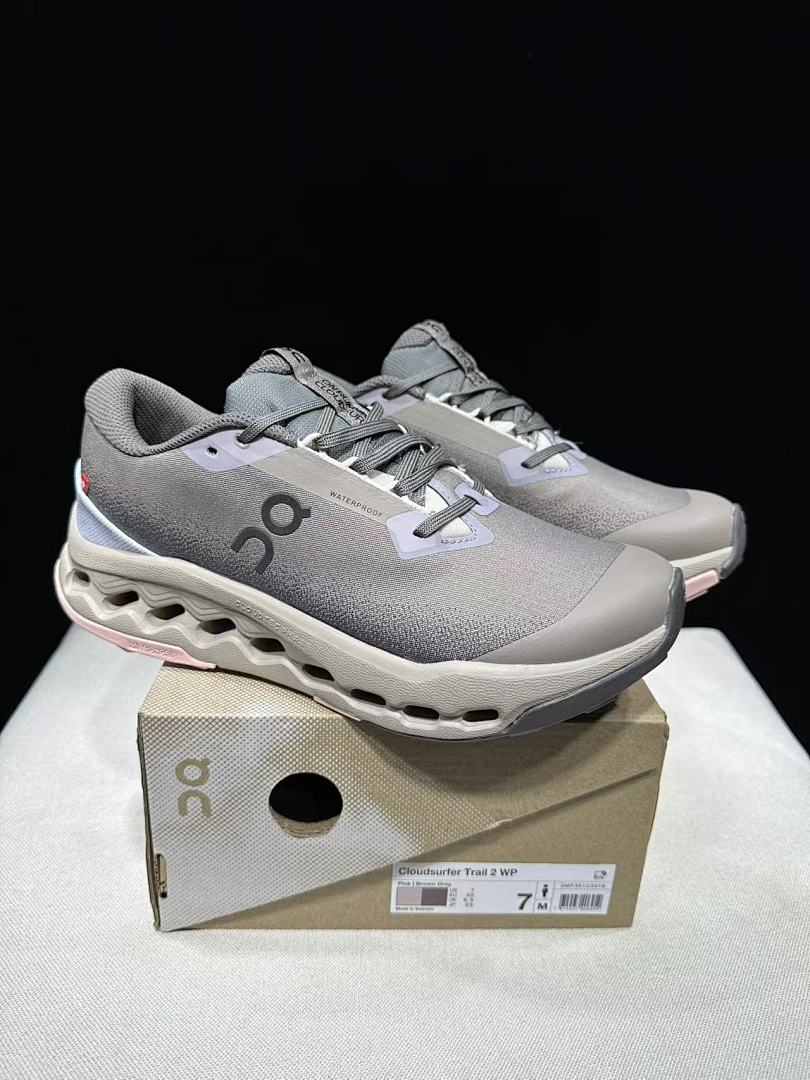 On Cloudsurfer Trail 2 Waterproof Trail Shoes Pink/Brown in Grey - product image from the listing.