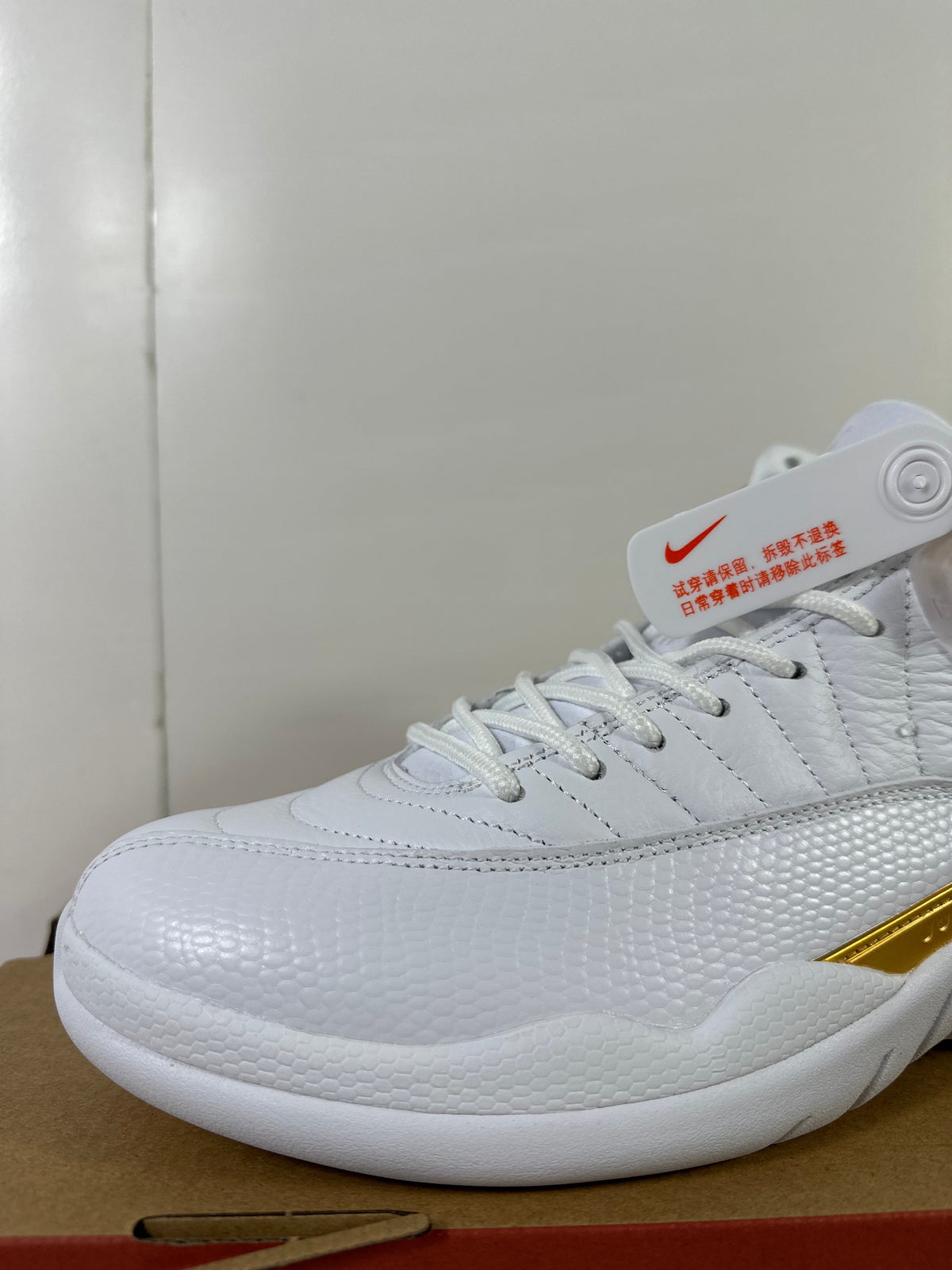 Air Jordan 12 Phantom White Metallic Gold Sneakers FD9101-007 - product image from the listing.