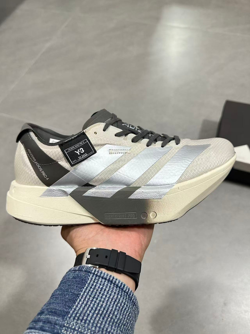 adidas Adizero Adios Pro 4 Running Shoes in White Black - product image from the listing.