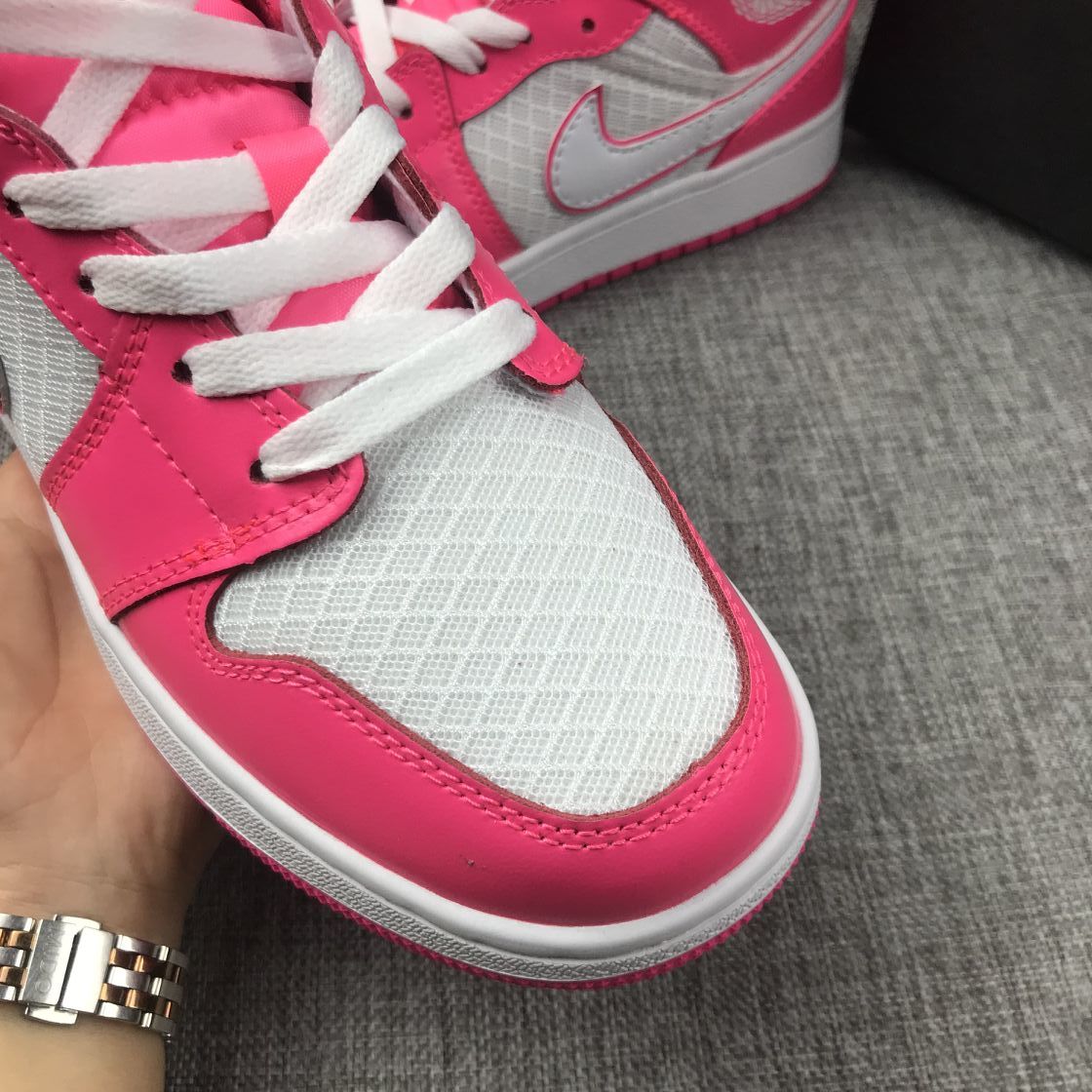 Air Jordan 1 Mid Sneakers in White Pink 555112-611 - product image from the listing.