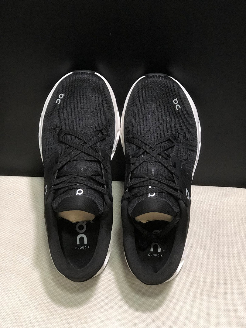 On Cloud X 4 Sneakers in Black and White - product image from the listing.