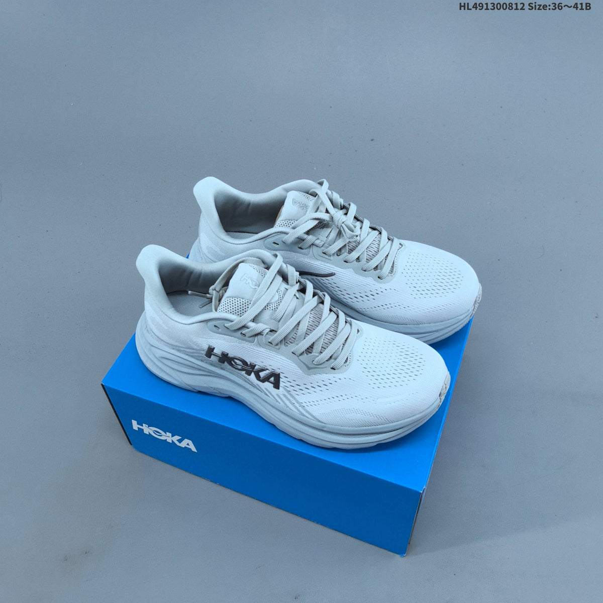 HOKA Clifton 11 Running Shoes in White - product image from the listing.