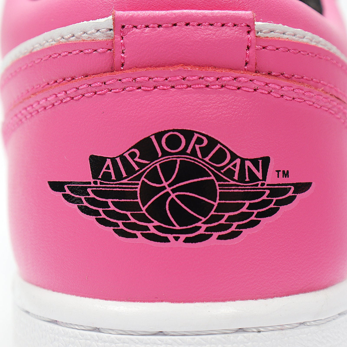 Jordan 1 Low Sneakers in Black Pink White 554723-106 - product image from the listing.