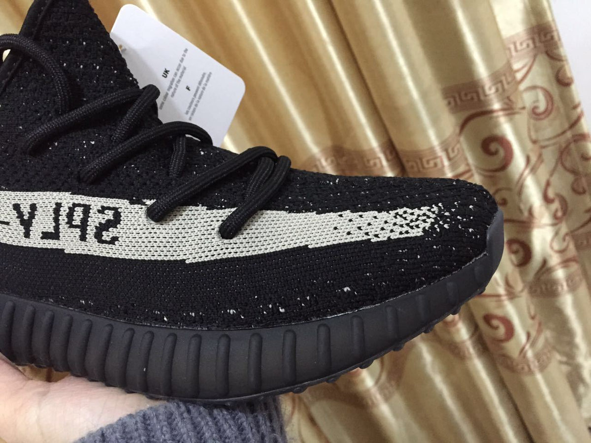 Adidas Yeezy Boost 350 V2 Sneakers in Black White - product image from the listing.