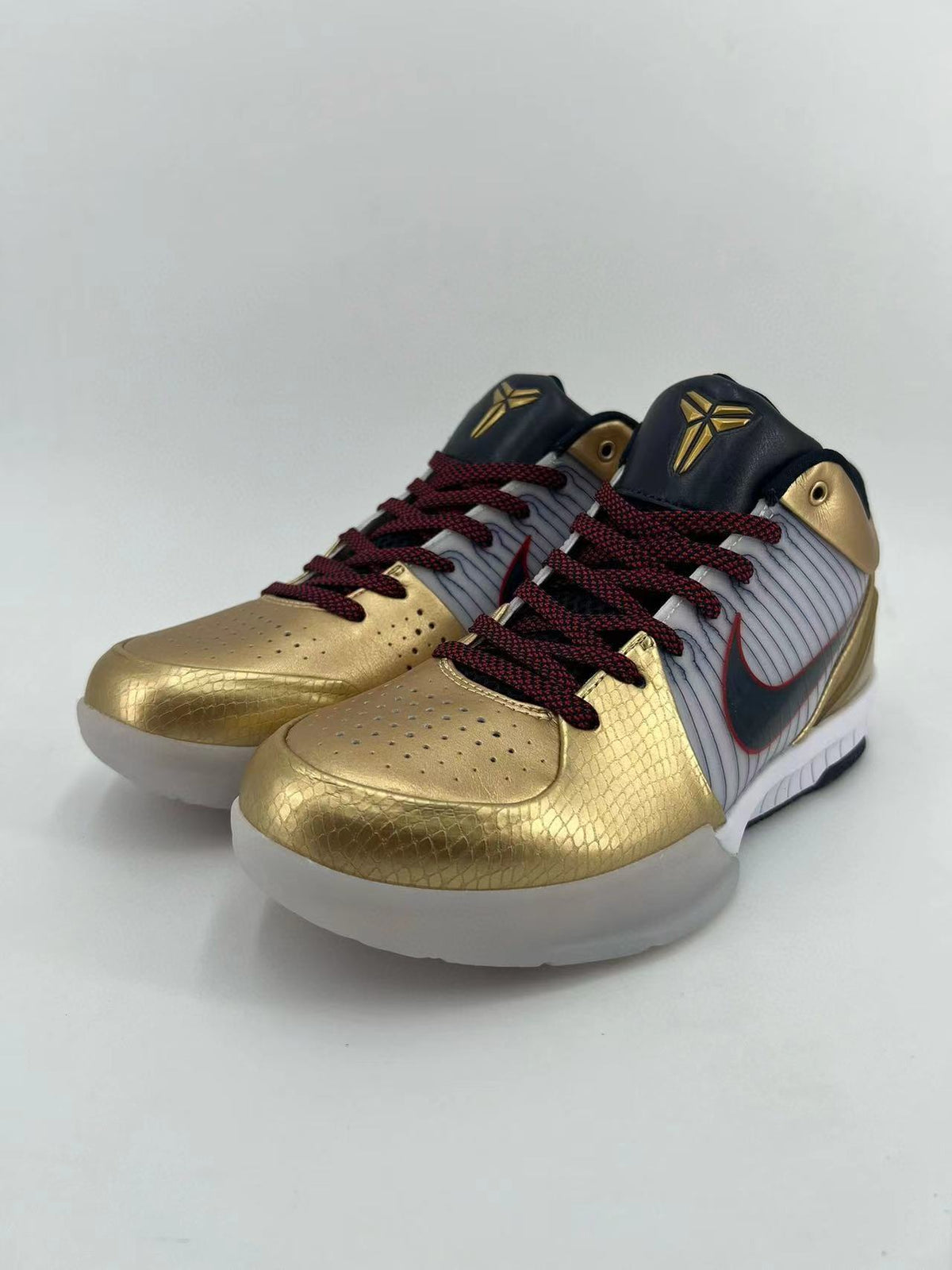 Nike Kobe 4 Protro Sneakers in Gold White 344335-141 - product image from the listing.