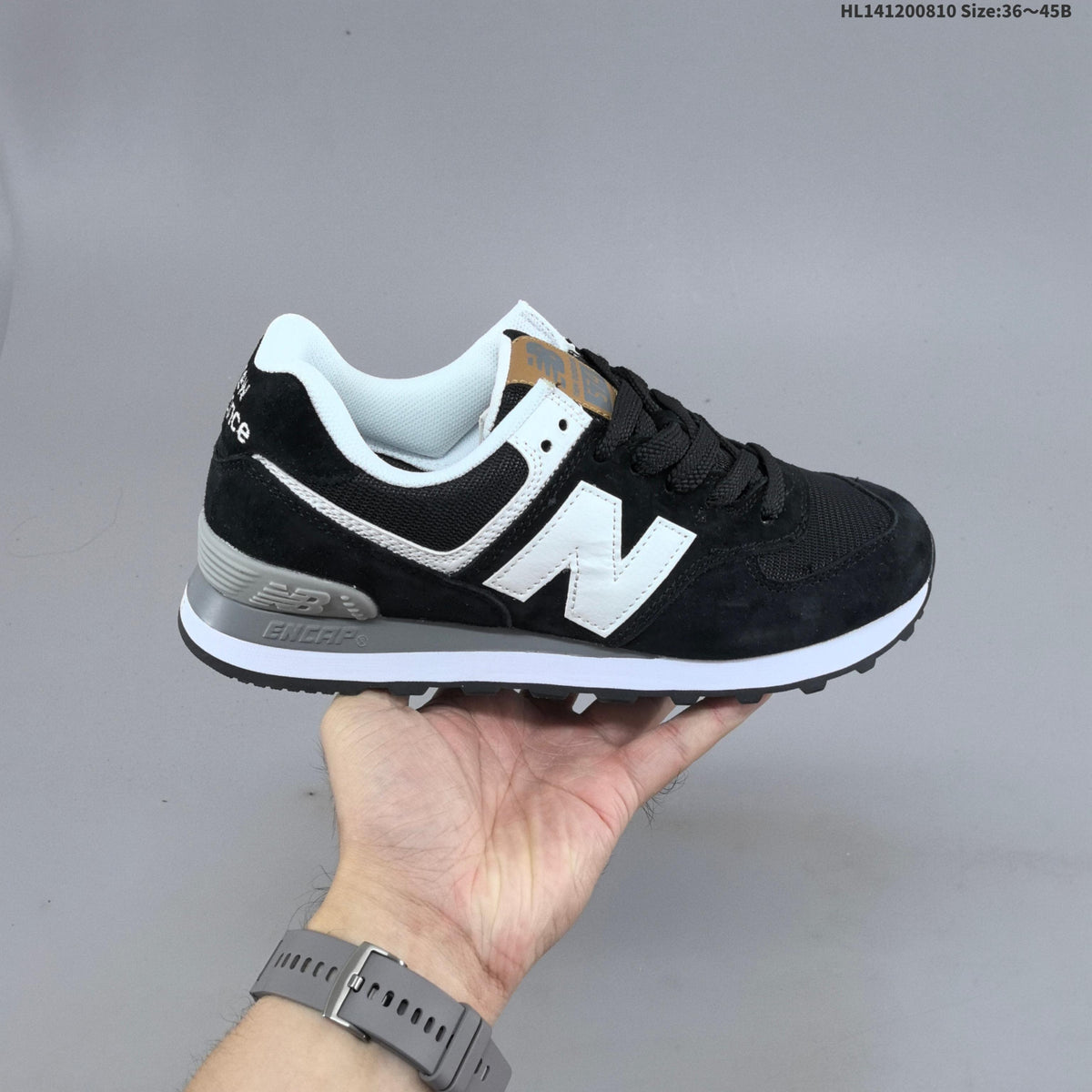 New Balance 574 Retro Sneakers in Black, Grey or in Cream - product image from the listing.