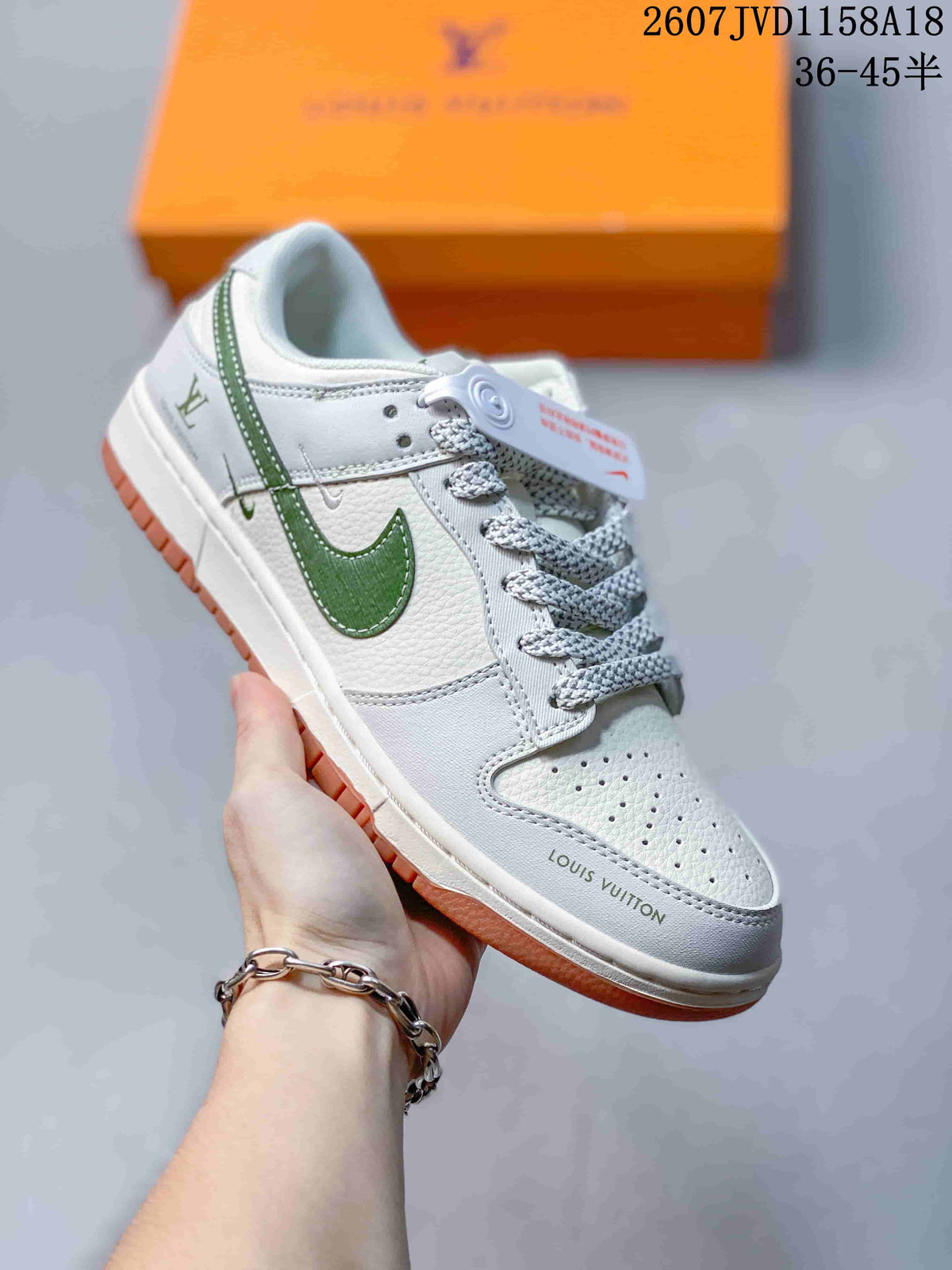 Nike SB Dunk Low Sneakers in White Green Gum 2607JVD1158A18 - product image from the listing.