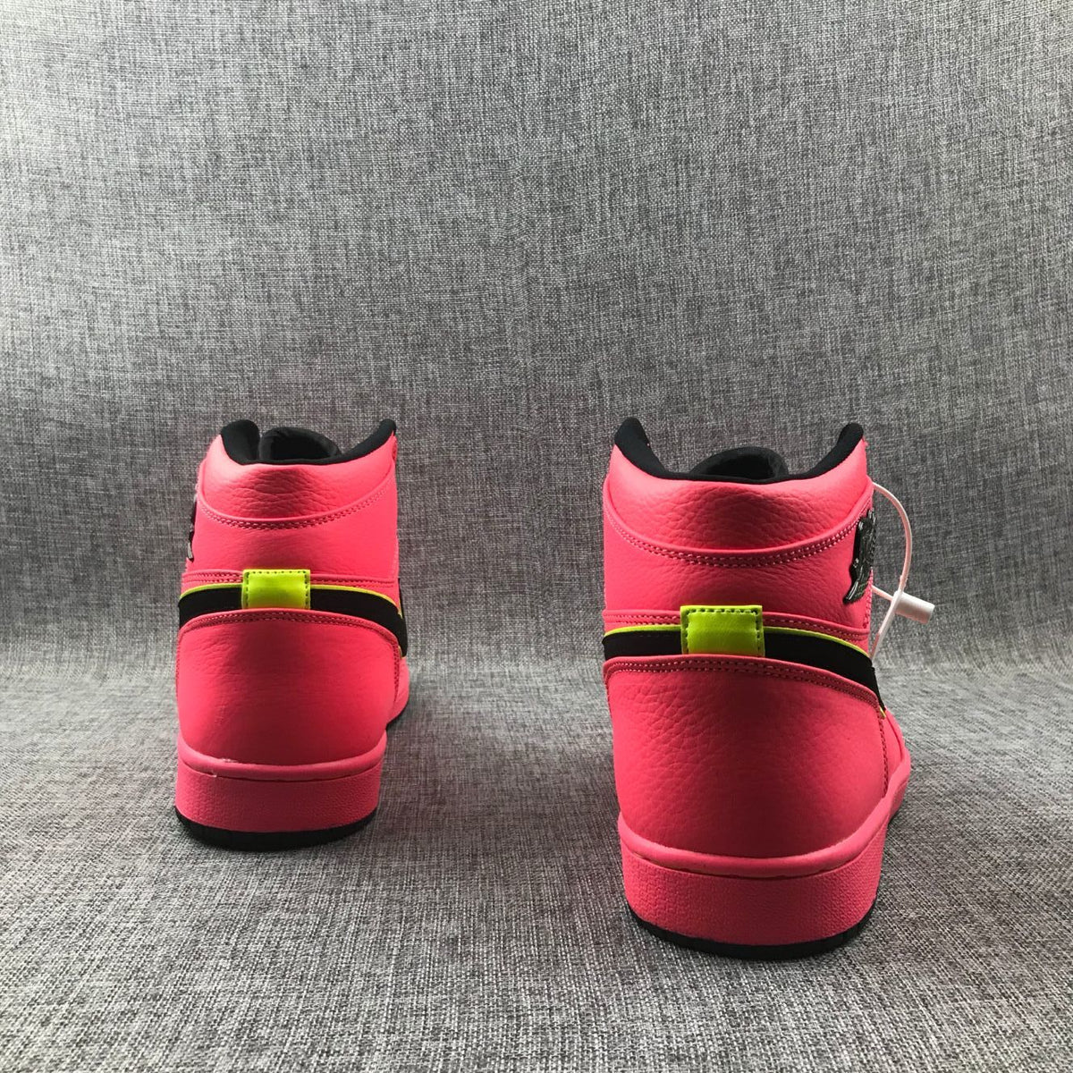 Air Jordan 1 Mid Sneakers in Pink Black Volt AQ9131-600 - product image from the listing.