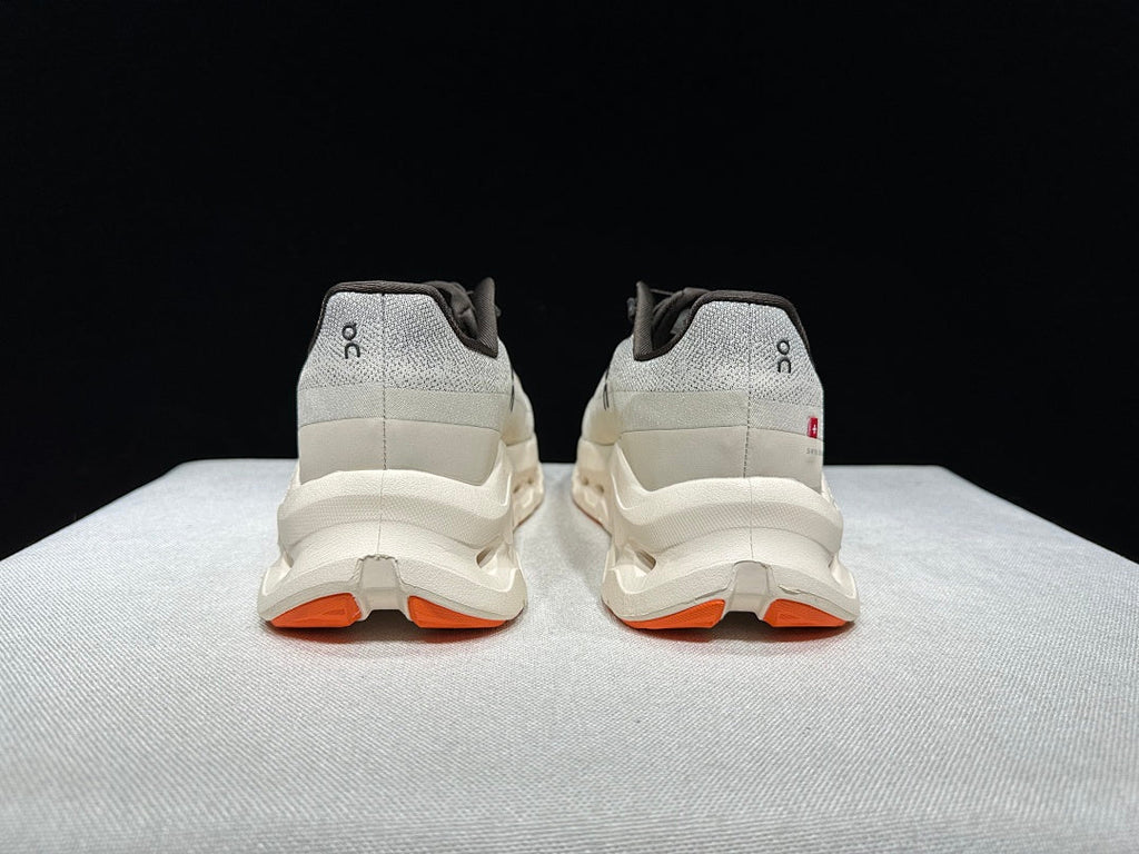 On Cloudtilt Trainers in Gray and Apricot - product image from the listing.