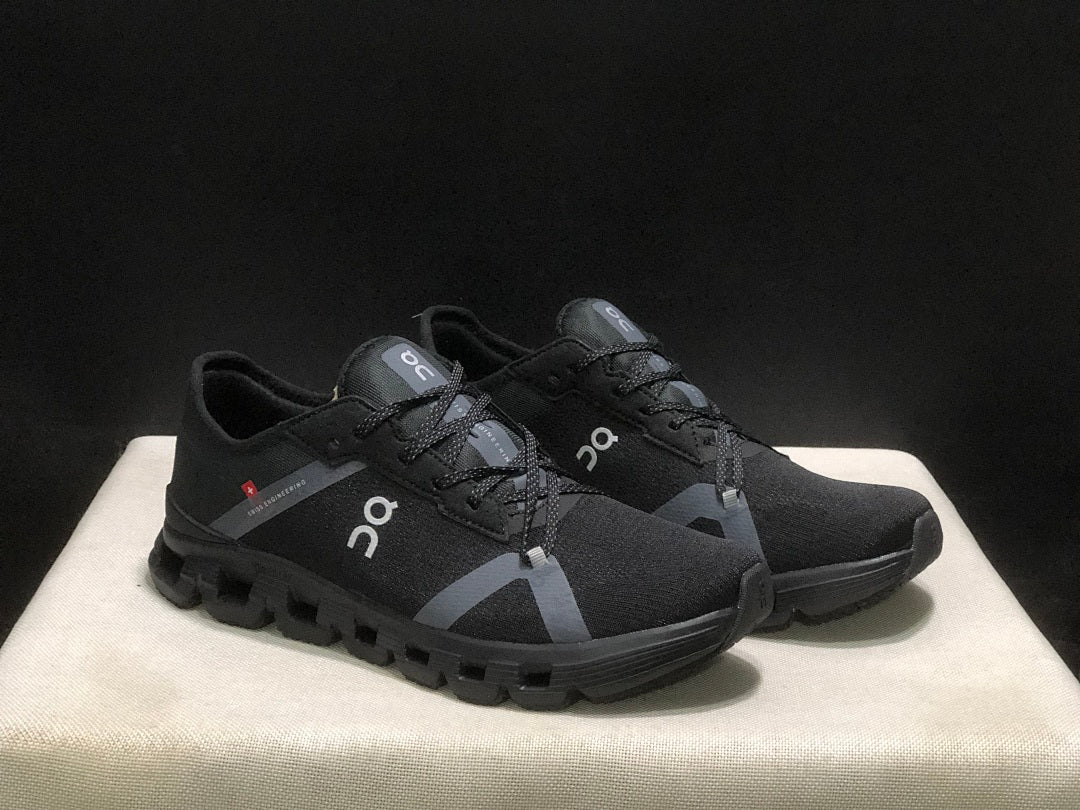 On Cloud X 4 AD Sneakers in Black - product image from the listing.