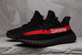 adidas Yeezy Boost 350 V2 Sneakers in Black Red - product image from the listing.